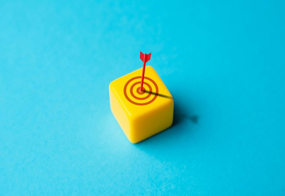 Yellow block with bull's eye on it: Represents finding the right content agency for you